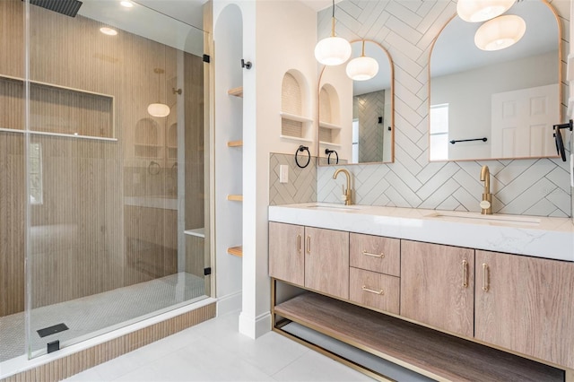 bathroom featuring tile patterned floors, an enclosed shower, decorative backsplash, and vanity