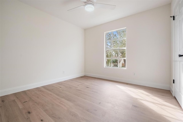 empty room with light hardwood / wood-style floors and ceiling fan