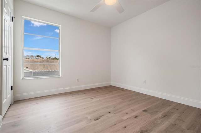 spare room featuring ceiling fan and light wood-type flooring