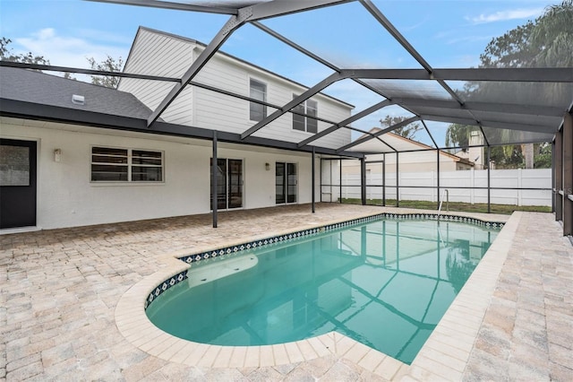 view of pool featuring a lanai and a patio