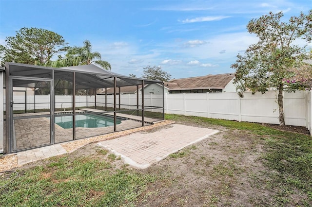 view of pool featuring a lanai and a patio area