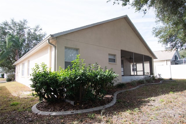 view of home's exterior featuring ceiling fan