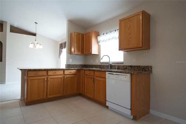 kitchen with lofted ceiling, sink, a chandelier, hanging light fixtures, and white dishwasher