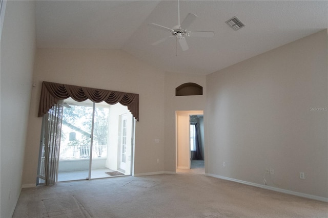 carpeted empty room featuring lofted ceiling and ceiling fan