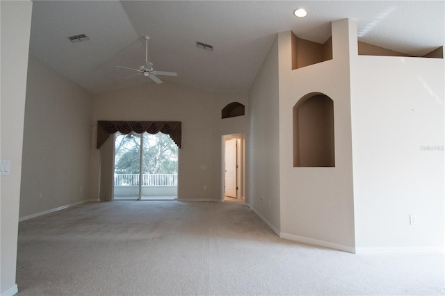 empty room with ceiling fan, high vaulted ceiling, and carpet