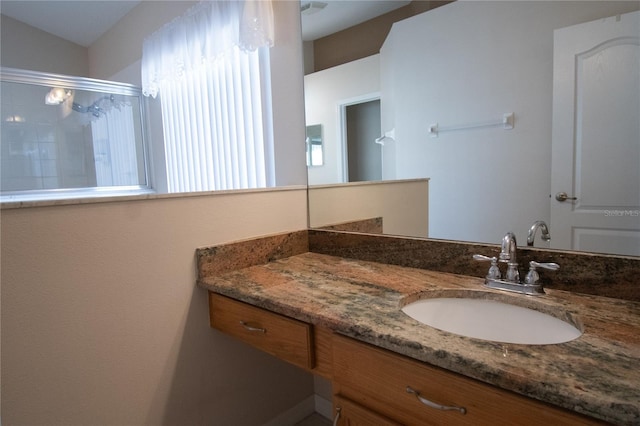 bathroom with vanity and an enclosed shower