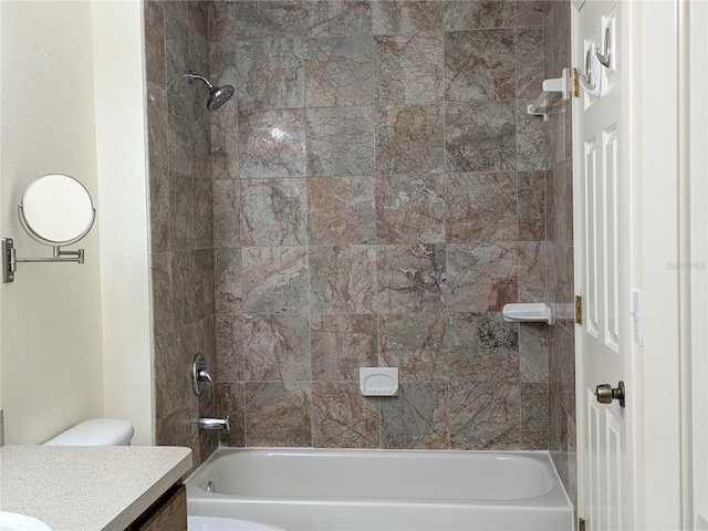 bathroom featuring toilet, bathing tub / shower combination, and vanity