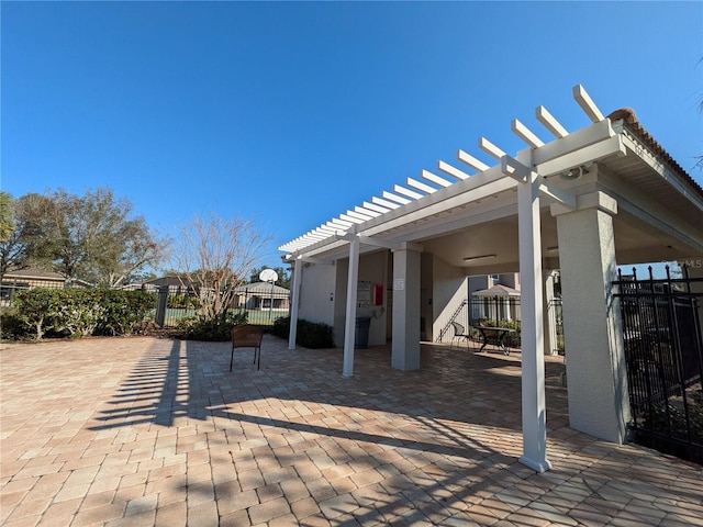 view of patio with fence and a pergola