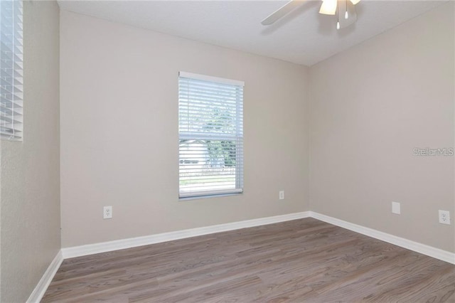 unfurnished room featuring ceiling fan and wood-type flooring