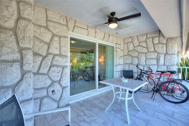 view of patio featuring ceiling fan