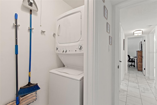 laundry room featuring stacked washer and dryer