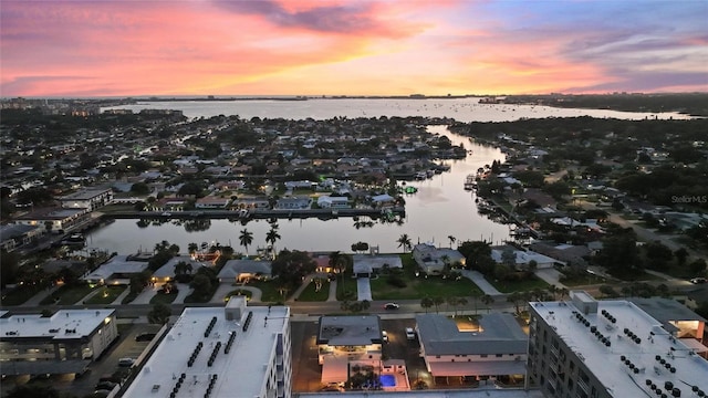 aerial view at dusk with a water view