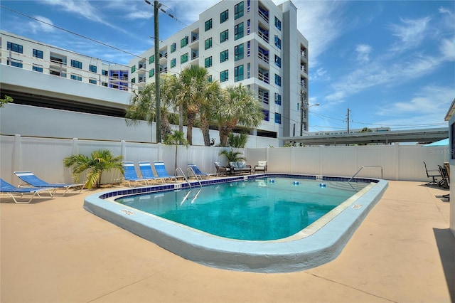 view of swimming pool with a patio area