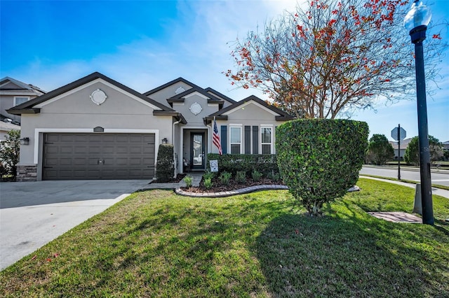 view of front of house featuring a garage and a front yard