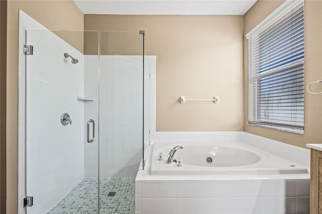 bathroom featuring vanity and shower with separate bathtub