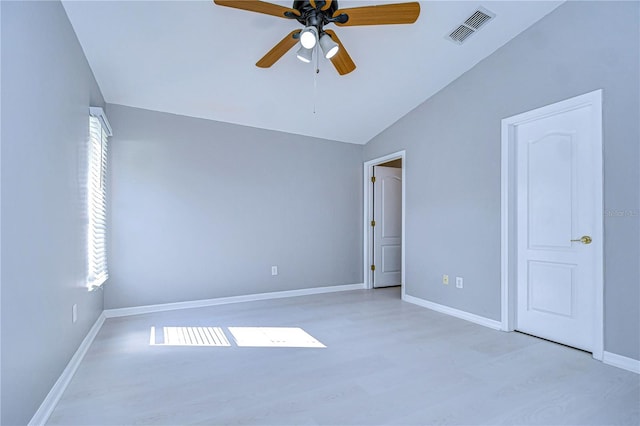 unfurnished bedroom featuring ceiling fan, vaulted ceiling, and light hardwood / wood-style flooring