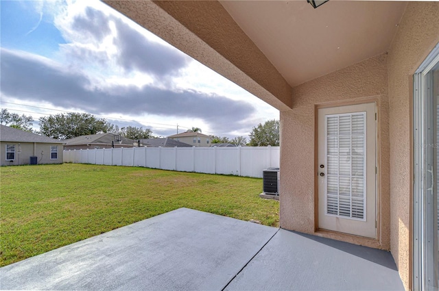 view of yard with a patio area and central air condition unit