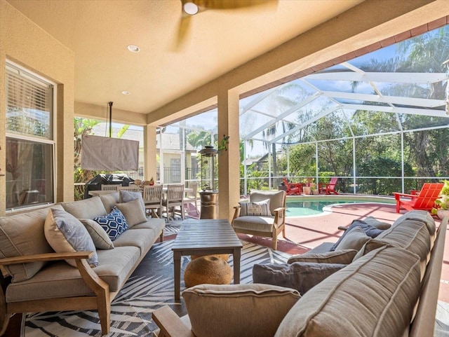 view of patio / terrace featuring outdoor lounge area and a lanai