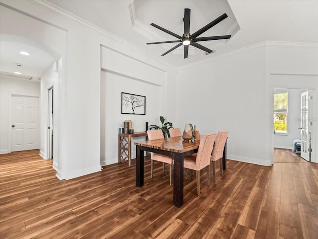 dining space featuring crown molding, ceiling fan, and dark hardwood / wood-style floors