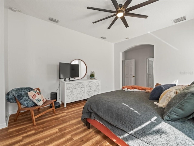 bedroom featuring hardwood / wood-style flooring and ceiling fan