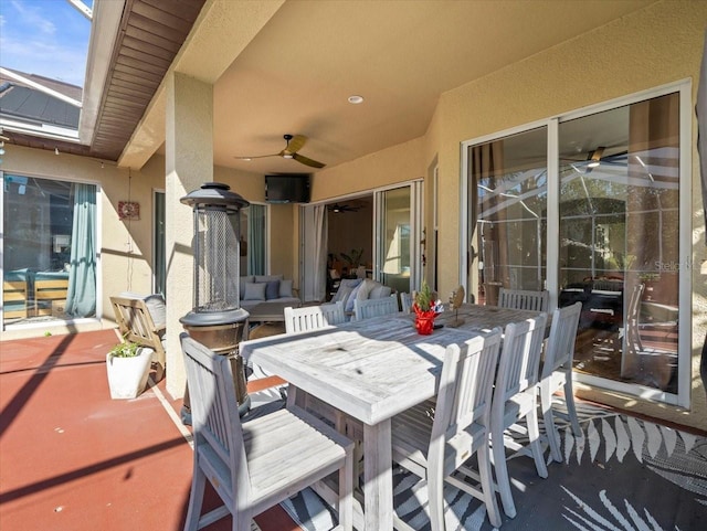 view of patio with a lanai and ceiling fan