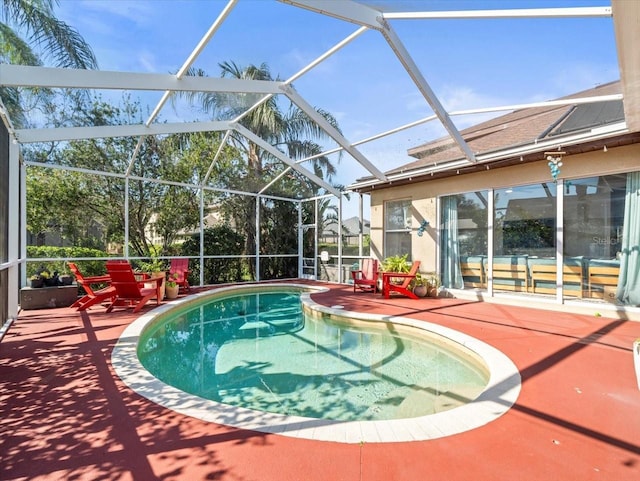 view of pool featuring a lanai and a patio area