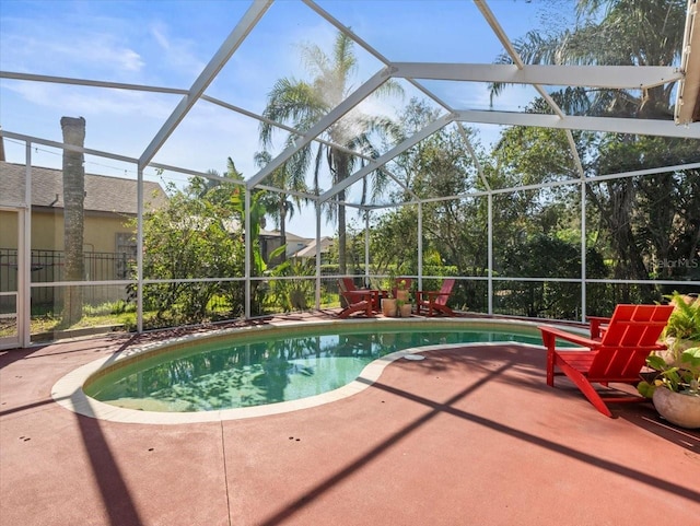 view of pool with a lanai and a patio area