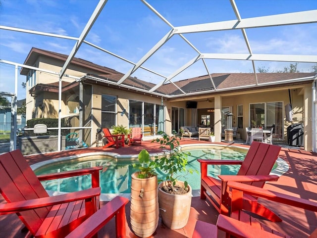 exterior space with a patio area and glass enclosure