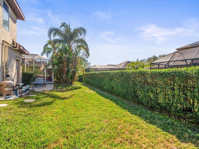 view of yard featuring a lanai