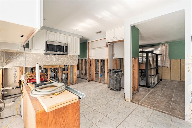 kitchen featuring white cabinetry