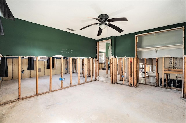 miscellaneous room with ceiling fan and concrete floors