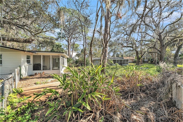 view of yard with a sunroom