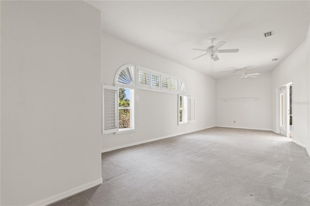 carpeted empty room featuring ceiling fan