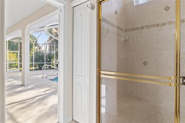 bathroom with a shower with door