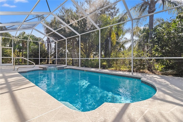 view of pool featuring a patio, a lanai, and an in ground hot tub