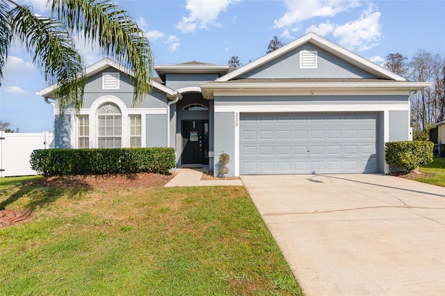 view of front of home with a garage and a front yard