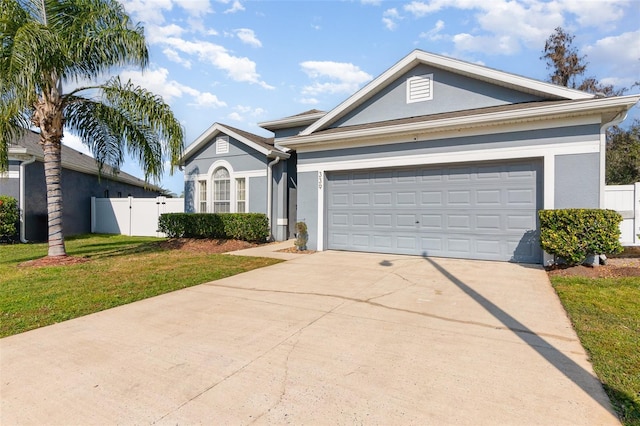 ranch-style home with a garage and a front yard