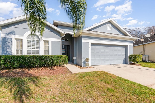 single story home featuring a garage and a front yard