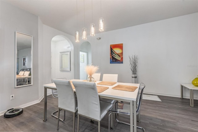 dining space with dark hardwood / wood-style floors