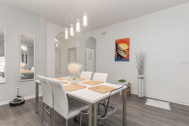 dining room with dark wood-type flooring