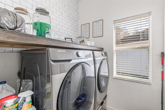 washroom with washing machine and dryer