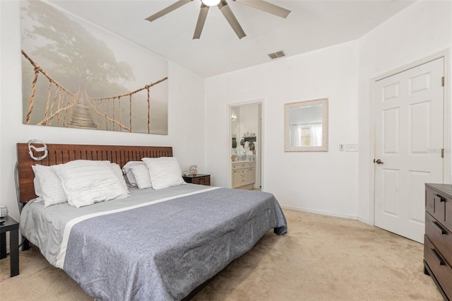 carpeted bedroom with ceiling fan and connected bathroom