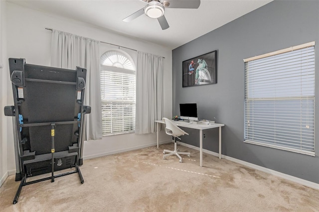 office space featuring light colored carpet and ceiling fan