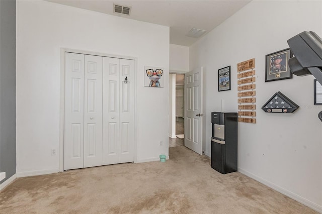 carpeted bedroom with a closet