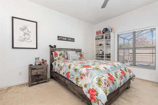 bedroom featuring light carpet and ceiling fan