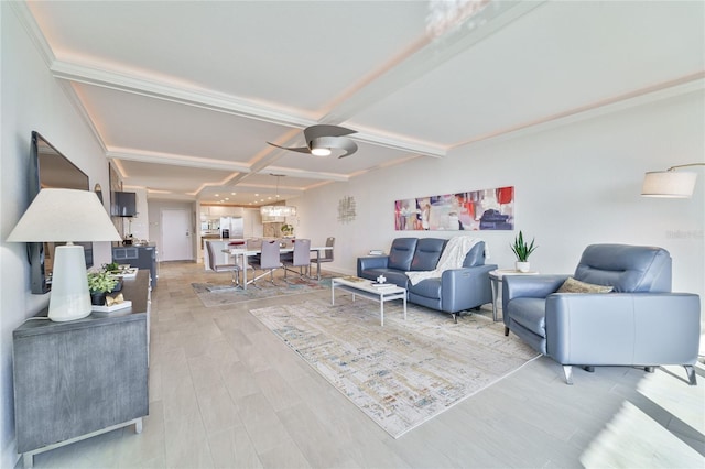 living room featuring coffered ceiling, beamed ceiling, and light wood-type flooring