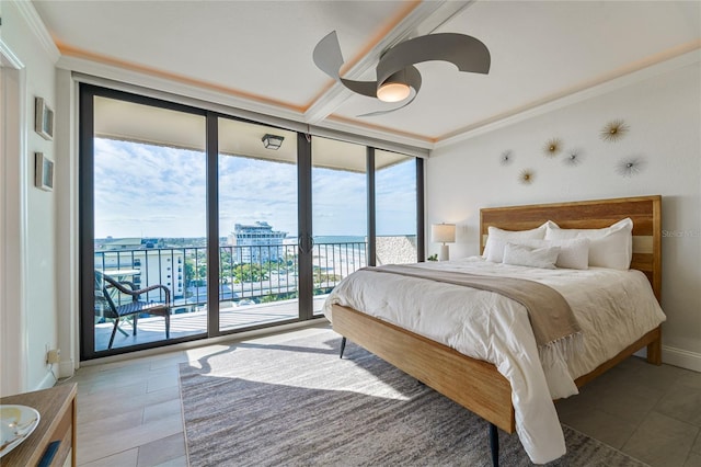 bedroom with crown molding, ceiling fan, access to exterior, a water view, and expansive windows