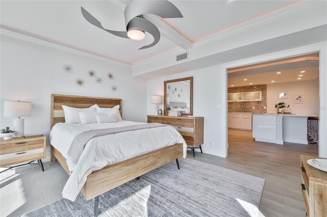 bedroom with ceiling fan and ornamental molding