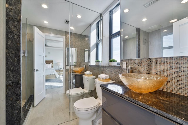 bathroom featuring walk in shower, toilet, tile walls, tile patterned flooring, and decorative backsplash