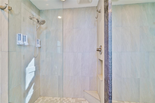 bathroom with a tile shower